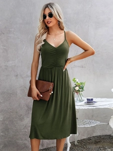 Close-up of olive green V-neck dress featuring spaghetti straps and pleated bust detail