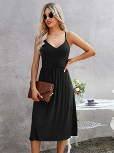 Detail of elegant black V-neck midi dress featuring ruched chest design and thin straps