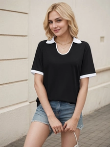 Women's short-sleeve polo shirt in black with white contrast trim and V-neckline