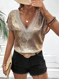 Women's V-neck satin blouse with lace crochet trim and metallic finish in golden hue