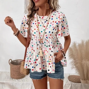 Detail of multi-color polka dot print and double-layered peplum hem on white summer t-shirt