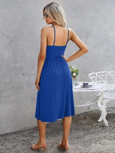 Detail of royal blue v-neck summer dress featuring slim straps and a backless design