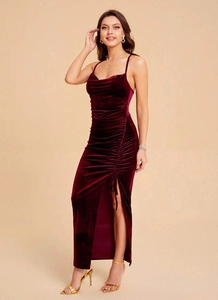 Close-up of ruched velvet dress detailing with side drawstring and high slit design