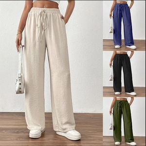 Detailed texture of high-waist loose wide-leg pants with elastic drawstring waistline