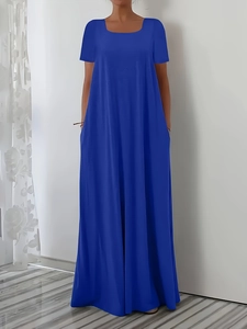 Detail view of the long dark blue short sleeve dress with a flowing loose maxi skirt