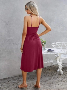 Back view of burgundy V-neck slip dress showing backless detail and gathered waist
