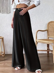 Elegant high-waisted black wide-leg trousers with central pleats and loose straight-cut fit