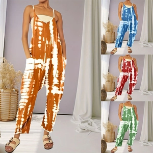 Detailed view of women's oversized tie-dye jumpsuit with thin straps and large side pockets