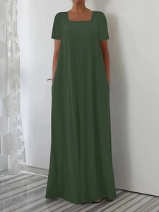 Detail of a dark green short sleeve maxi dress with square neckline and loose flowy fit