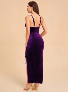 Detail of deep purple velvet evening dress showing slim fit silhouette and side slit