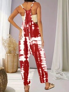 Detail of red and white tie-dye jumpsuit with backless thin straps and low crotch fit