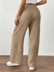 Back view of women's khaki high-waisted wide-leg trousers with textured fabric detail