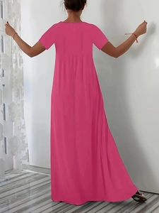 Back view of a rose red plus size maxi dress with short sleeves and flowing skirt