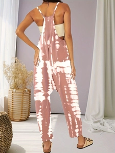 Back view of pink tie-dye harem jumpsuit with wide straps and backless detail