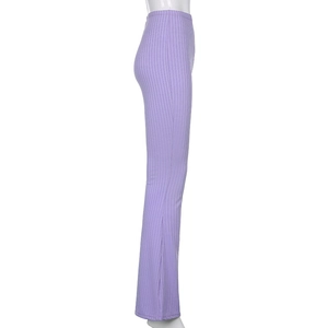 Detail view of purple ribbed knit high waist flare pants with side slit hem design