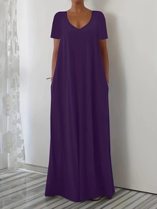 Detail view of a deep purple maxi dress featuring a V-neckline and loose short sleeves