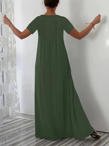 Detail view of the back of olive green loose fit maxi dress in soft cotton fabric