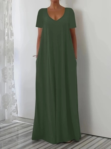 Detail of dark olive green maxi dress featuring a classic V-neck and practical side pockets