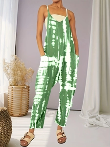 Women's green tie-dye plus size jumpsuit with wide legs, pockets and thin straps