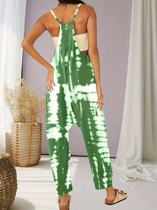 Rear view of green tie-dye loose jumpsuit featuring slim racerback straps for women