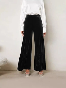 Women's high waist black velvet wide leg trousers with elegant draped pleats and glossy finish