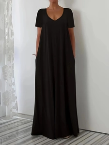 Front view of black short sleeve maxi dress with deep V-neck and loose flowing silhouette