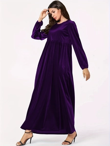 Detail of elegant high-waisted pleats and velvet fabric on a deep purple maxi dress