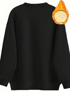 Detail of black crewneck sweatshirt showing thick fleece lining for thermal warmth