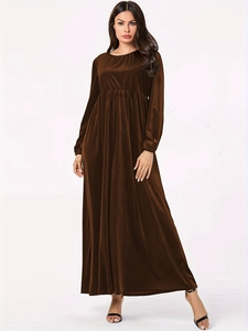 Detail showing the pleated waist and velvet texture of the brown long sleeve maxi dress