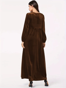 Back view of elegant long sleeve velvet dress with high waist pleats and lantern sleeves