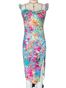 Detail of floral print pattern on a light blue summer dress with side slit design