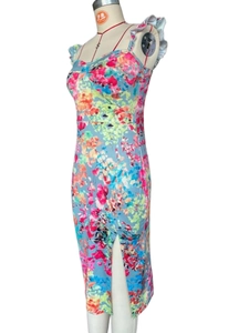 Detailed side view of floral midi dress with ruffle straps and high side slit