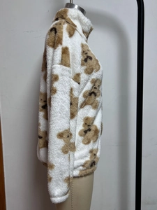 Detail of white plush teddy bear fleece hoodie with high neck and drop shoulder design