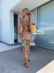 Detail of floral midi dress with ruffle straps and elegant side slit for summer look