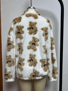 Rear view of white plush jacket with brown teddy bear print and ribbed hem detail