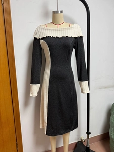 Close-up of contrast cable-knit details on elegant slim-fit long sleeve grey dress