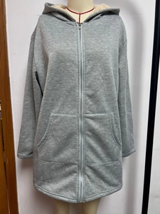 Close-up of long zip-up hoodie with warm fleece lining and front pockets in heather grey