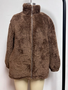 Close-up of thick dark brown fleece jacket with metal zipper and stand-up collar design