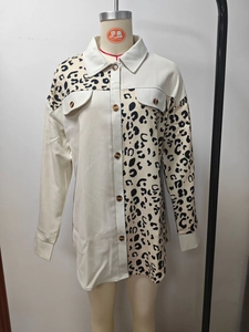 Detail of the leopard print and beige patchwork design on the chest pocket and collar