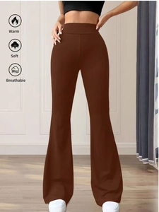Detail showing the brown ribbed knit texture and high-waisted fit of these flared pants