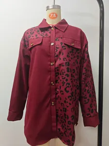 Detail shot of leopard print patchwork on wine red long sleeve shirt with front pockets