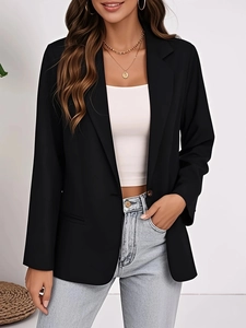 Detailed view of women's black blazer lapel with high-quality polyester blend texture