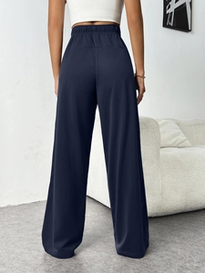 Rear view of high-waisted navy blue wide-leg lounge pants with elastic waistband