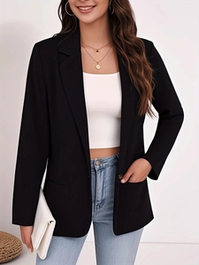 Close-up of slim-fit black blazer with notch lapels and single-button closure detail
