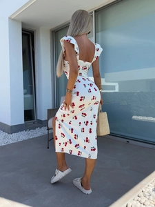 Detail view of floral print dress with ruffle straps, shirred back and high side slit