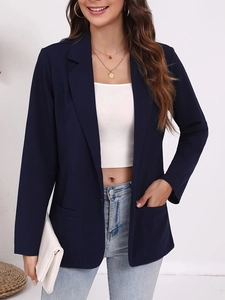 Detail of navy blue slim fit blazer with notched lapel and functional side pockets