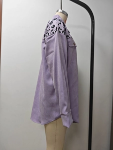 Detail view of purple shacket with leopard print panel on collar and chest pocket
