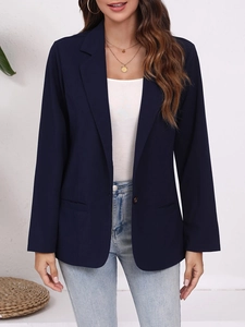 Detailed view of the lapel and single button on a navy blue women's casual blazer jacket