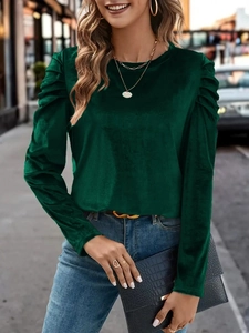 Slim fit dark green velvet long sleeve top with puff shoulders and round neck