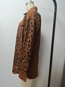Detail of leopard print stitching and metallic buttons on a women cardigan jacket